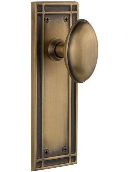 Mission Door Set with Oval Knobs in Antique Brass.